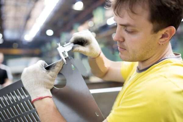inspector-measuring-detail-industrial-worker-vernier-caliper-factory-workshop-42376033-min